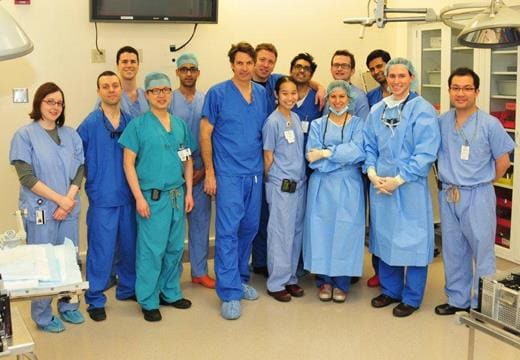 Dr. James Bradley in operating room with residents.