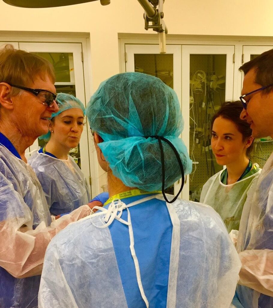 Dr. Richard Warren, left, discusses facelift procedures with plastic surgery residents.